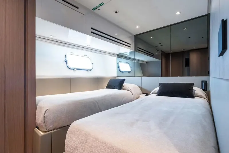  Yacht Photos Pics Luxurious twin bedroom in 2024 Sanlorenzo SX76 yacht, featuring modern design and elegant decor.
