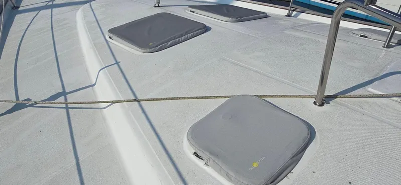 Lucy In The Sky Yacht Photos Pics Deck of 2001 Beneteau Oceanis 473 sailboat with hatches and railings.