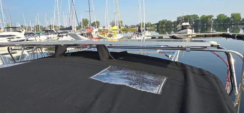 Lucy In The Sky Yacht Photos Pics Beneteau Oceanis 473 sailboat, 2001 model, docked in a marina with clear skies.