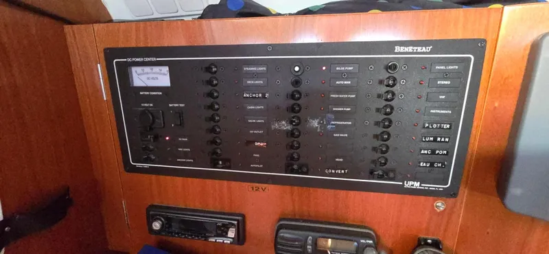 Lucy In The Sky Yacht Photos Pics Control panel of a 2001 Beneteau Oceanis 473 sailboat, featuring various switches and indicators.