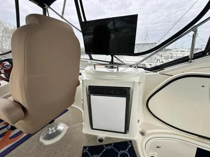  Yacht Photos Pics Captain's chair and console on 2008 Meridian 391 Sedan yacht, featuring a mounted screen.