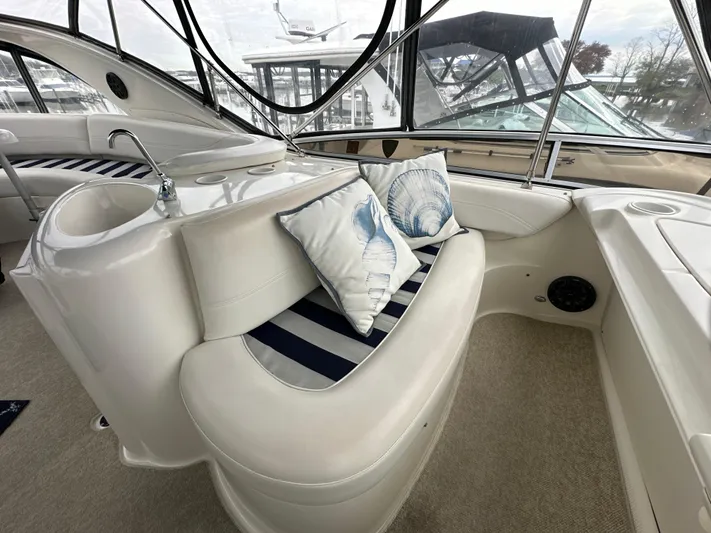 Yacht Photos Pics Luxurious 2008 Meridian 391 Sedan yacht interior with striped seating and decorative pillows.