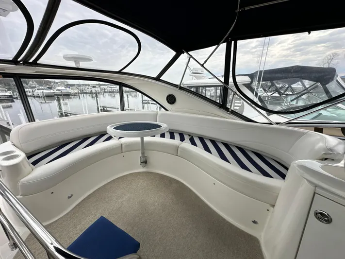  Yacht Photos Pics 2008 Meridian 391 Sedan yacht interior with curved seating and marina view.
