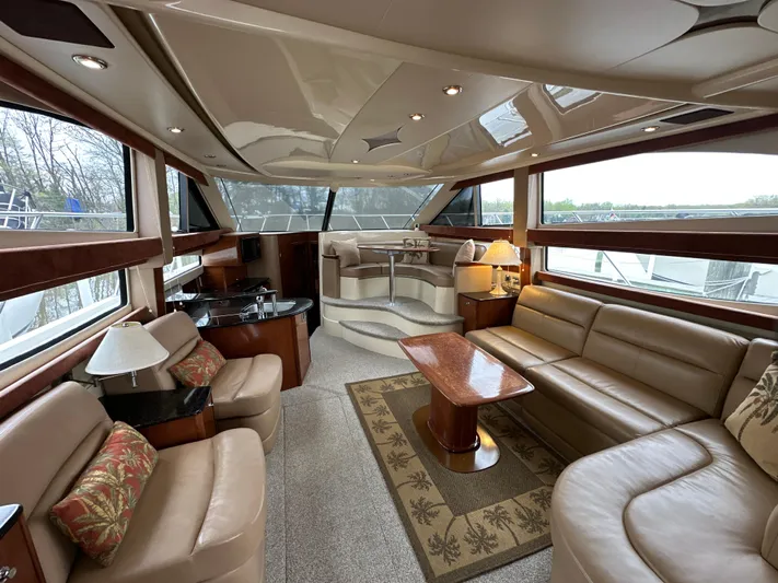  Yacht Photos Pics Luxurious interior of a 2008 Meridian 391 Sedan yacht with elegant seating and panoramic windows.