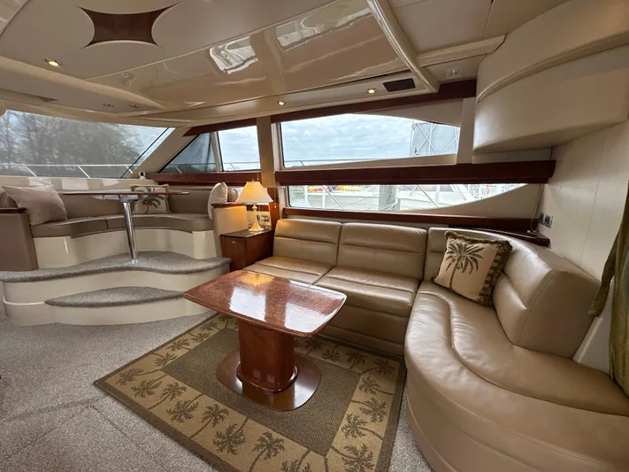  Yacht Photos Pics Luxurious interior of a 2008 Meridian 391 Sedan yacht with elegant seating and wooden table.