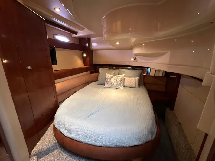  Yacht Photos Pics Luxurious cabin interior of 2008 Meridian 391 Sedan yacht with cozy bed and elegant wood finishes.