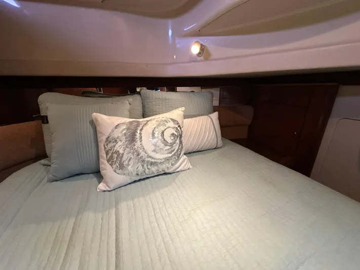  Yacht Photos Pics Cozy bedroom in 2008 Meridian 391 Sedan with decorative pillows and soft lighting.