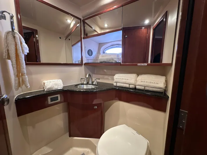  Yacht Photos Pics Luxurious bathroom in 2008 Meridian 391 Sedan yacht with elegant fixtures and towels.