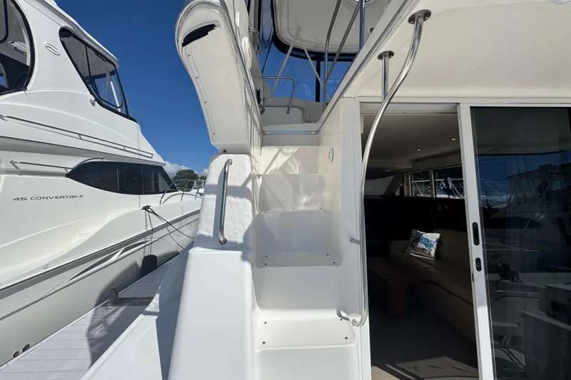 She's From Boston Yacht Photos Pics 2003 Silverton 42 Convertible yacht with exterior stairs and interior view.