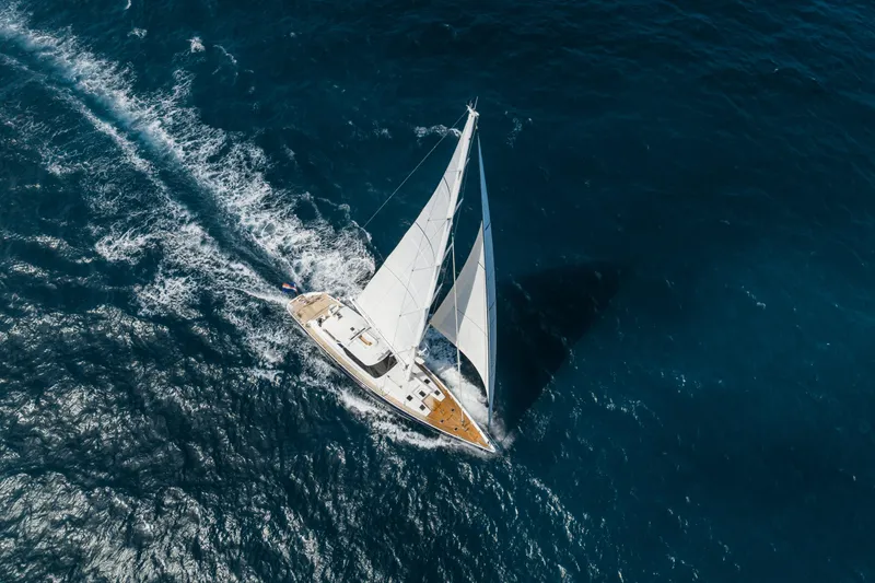 Seaquell Yacht Photos Pics Aerial view of 1992 Alloy Yachts sailboat cruising on open blue sea.