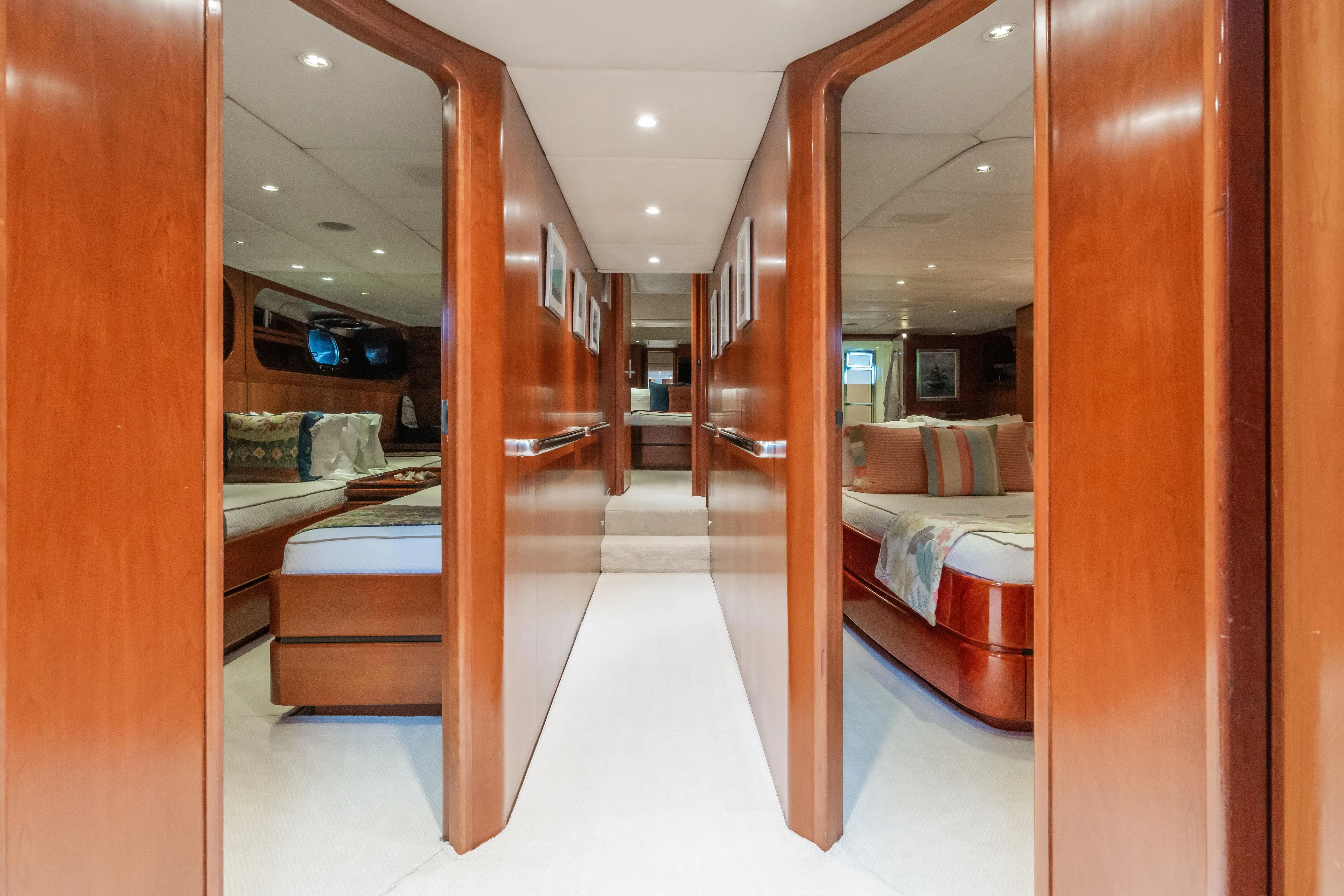 Seaquell Yacht Photos Pics Luxurious interior of a 1992 Alloy Yachts sailboat with wooden finishes and cozy cabins.