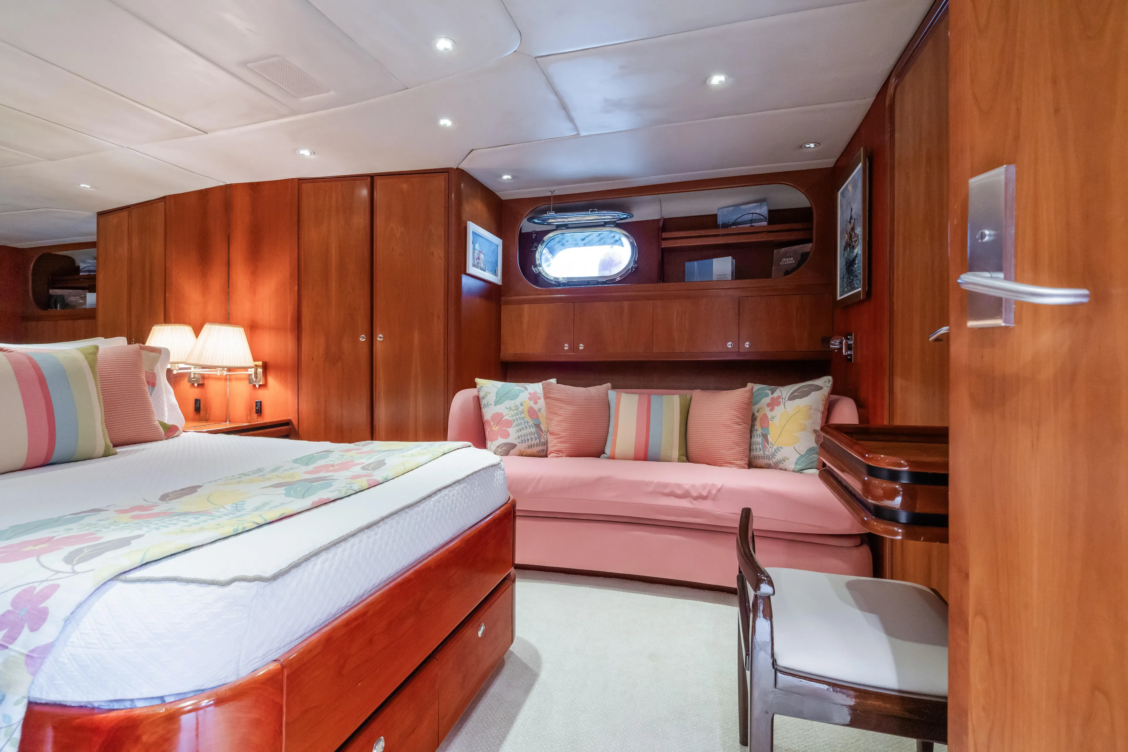 Seaquell Yacht Photos Pics Luxurious 1992 Alloy Yachts sailboat bedroom with wooden interior and cozy seating area.
