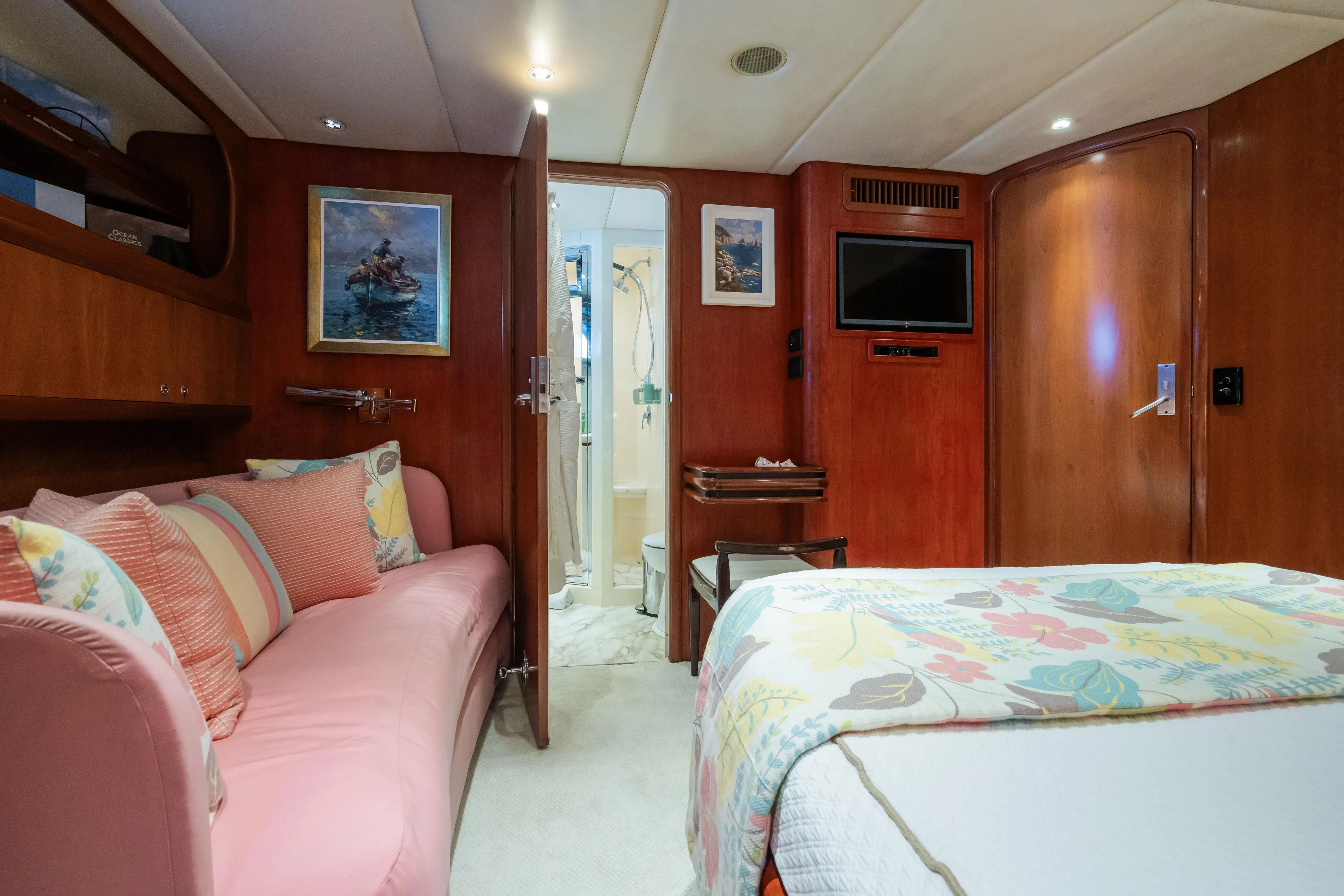Seaquell Yacht Photos Pics Luxurious 1992 Alloy Yachts sailboat cabin with cozy bed, sofa, and ensuite bathroom.