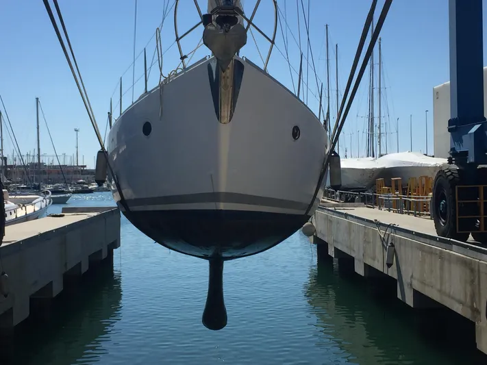  Yacht Photos Pics Sailboat Elan Impression 434 (2005) suspended over water in a marina setting.