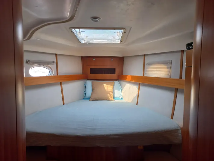  Yacht Photos Pics Cozy cabin interior of 2005 Elan Impression 434 yacht with skylight and wooden accents.