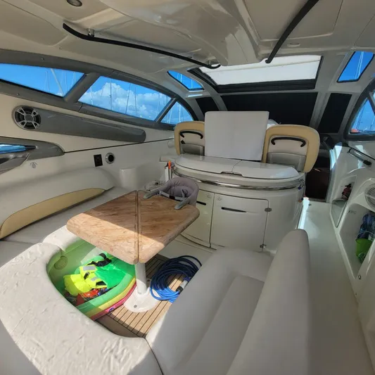  Yacht Photos Pics Interior of 2006 Cranchi Mediterranee 47 HT yacht with seating and table.