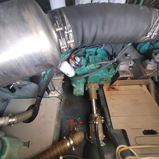  Yacht Photos Pics Engine room of 2006 Cranchi Mediterranee 47 HT yacht, showing mechanical components and piping.