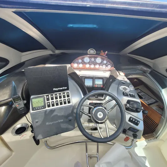  Yacht Photos Pics Helm of 2006 Cranchi Mediterranee 47 HT with Raymarine navigation equipment.