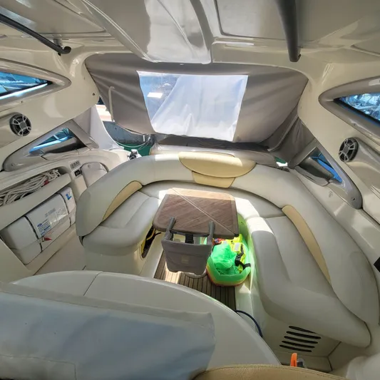  Yacht Photos Pics Interior of 2006 Cranchi Mediterranee 47 HT yacht with plush seating and table.