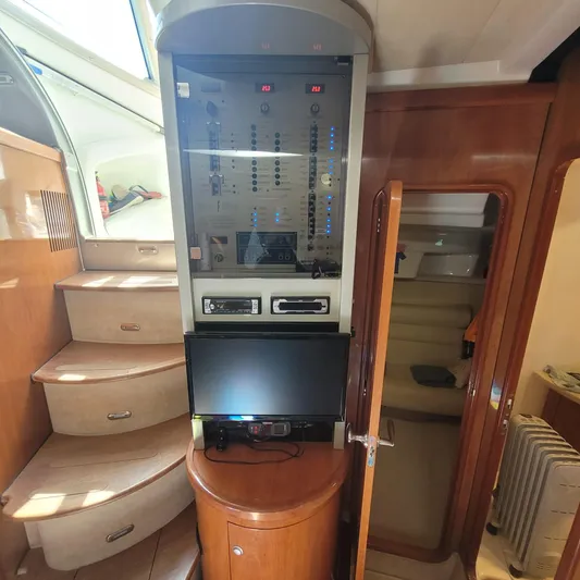  Yacht Photos Pics Interior of 2006 Cranchi Mediterranee 47 HT yacht with control panel and stairs.