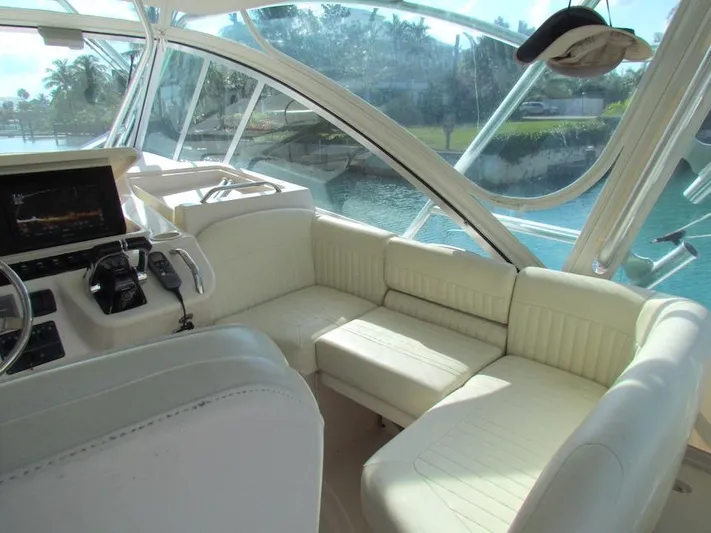  Yacht Photos Pics Interior of 2008 Grady-White Express 360 boat with white seating and helm controls.