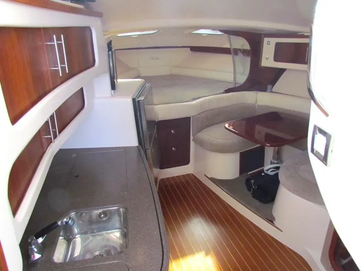  Yacht Photos Pics Interior of 2008 Grady-White Express 360 boat with kitchen and seating area.