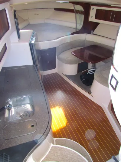  Yacht Photos Pics 2008 Grady-White Express 360 interior with kitchenette, seating area, and wooden flooring.