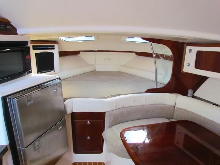 Yacht Photos Pics 2008 Grady-White Express 360 cabin interior with kitchenette and seating area.
