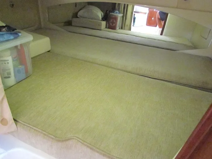  Yacht Photos Pics 2008 Grady-White Express 360 cabin interior with beige bedding and storage.