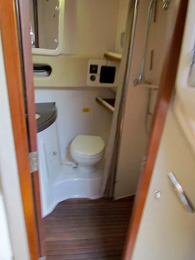  Yacht Photos Pics 2008 Grady-White Express 360 boat bathroom with wooden flooring and compact design.
