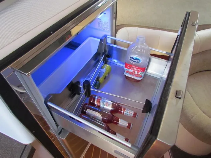  Yacht Photos Pics Open fridge drawer on 2008 Grady-White Express 360, containing drinks and cranberry juice.