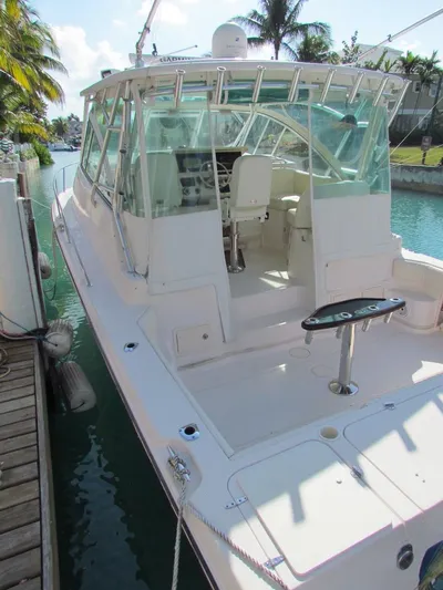  Yacht Photos Pics 2008 Grady-White Express 360 boat docked on a sunny day, featuring spacious cockpit and helm.