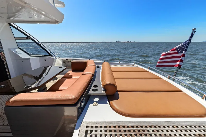 Rock Water Yacht Photos Pics Luxurious 2013 Cheoy Lee 76 Alpha yacht with sun loungers and American flag on deck.