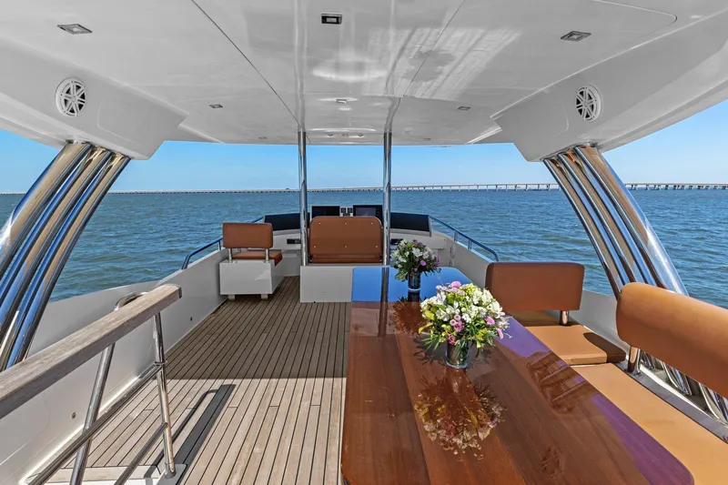 Rock Water Yacht Photos Pics Luxurious 2013 Cheoy Lee 76 Alpha yacht deck with elegant seating and ocean view.