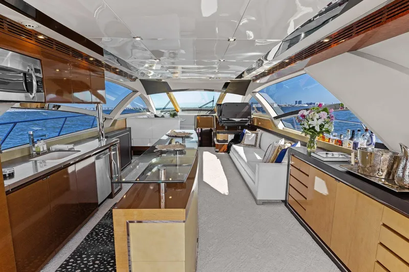 Rock Water Yacht Photos Pics Luxurious interior of 2013 Cheoy Lee 76 Alpha yacht with modern kitchen and seating area.