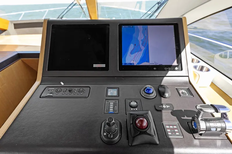 Rock Water Yacht Photos Pics Control panel of 2013 Cheoy Lee 76 Alpha yacht with navigation screens and controls.