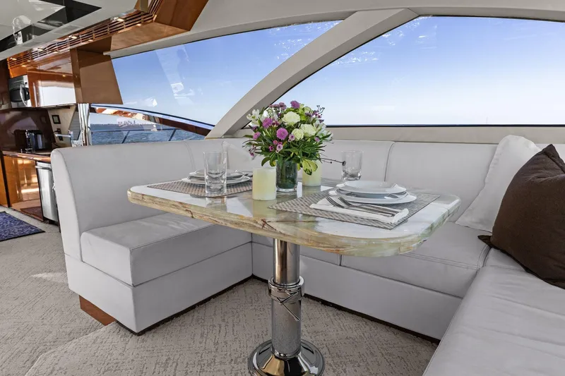 Rock Water Yacht Photos Pics Luxurious interior of 2013 Cheoy Lee 76 Alpha yacht with elegant dining area.