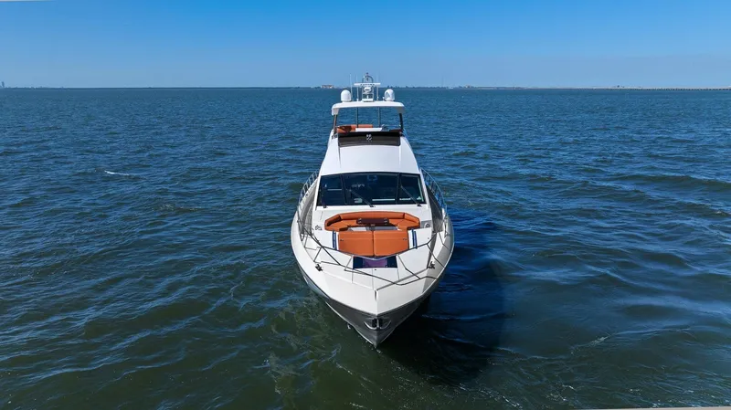 Rock Water Yacht Photos Pics 2013 Cheoy Lee 76 Alpha yacht cruising on open water under clear blue skies.