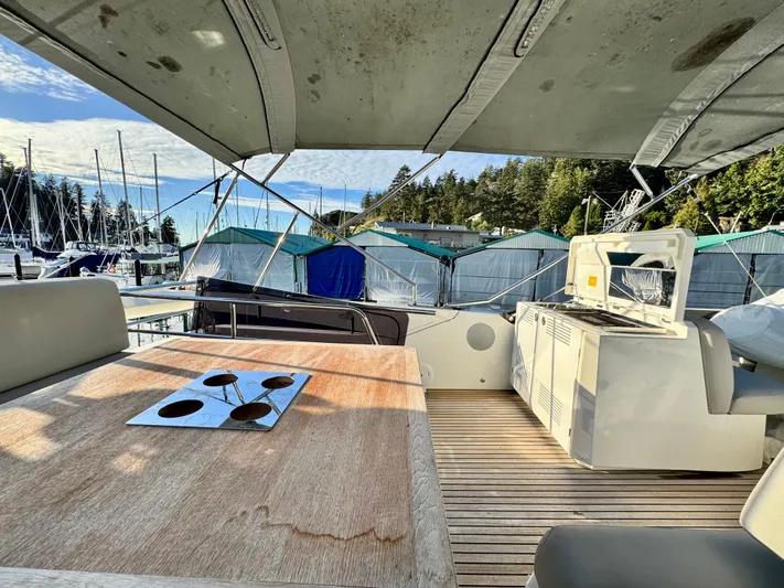 Seacresea Yacht Photos Pics Luxurious 2019 Prestige 520 yacht interior with wooden table and marina view.