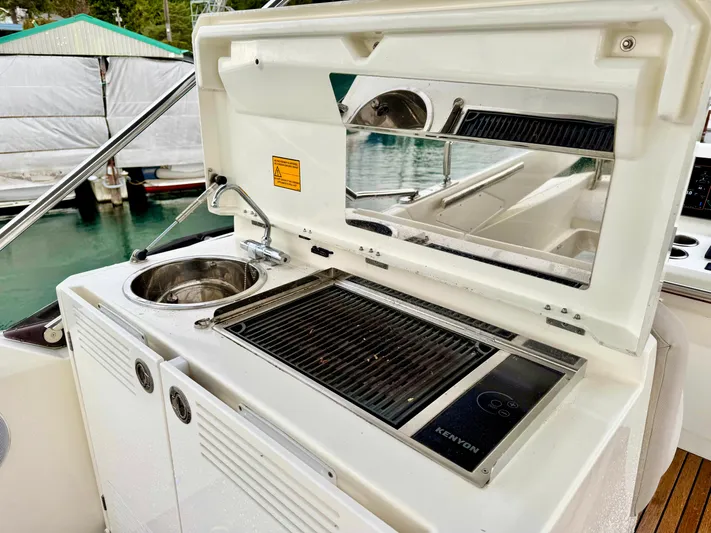 Seacresea Yacht Photos Pics Outdoor kitchen on 2019 Prestige 520 yacht with sink and grill.