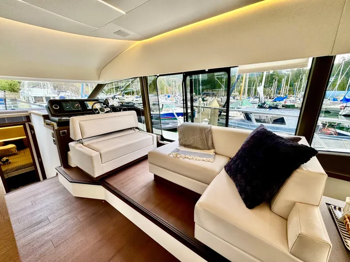 Seacresea Yacht Photos Pics Luxurious interior of 2019 Prestige 520 yacht with elegant seating and marina view.