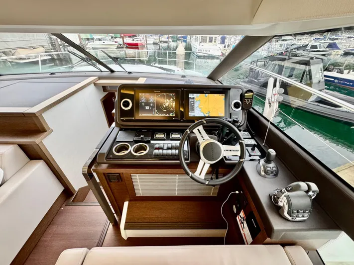 Seacresea Yacht Photos Pics Helm of 2019 Prestige 520 yacht with modern navigation equipment and steering wheel.
