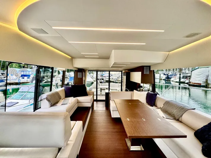 Seacresea Yacht Photos Pics Luxurious interior of a 2019 Prestige 520 yacht with elegant seating and marina view.