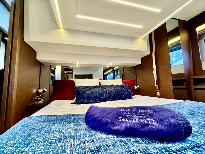 Seacresea Yacht Photos Pics Luxurious interior of 2019 Prestige 520 yacht with elegant bedding and ambient lighting.