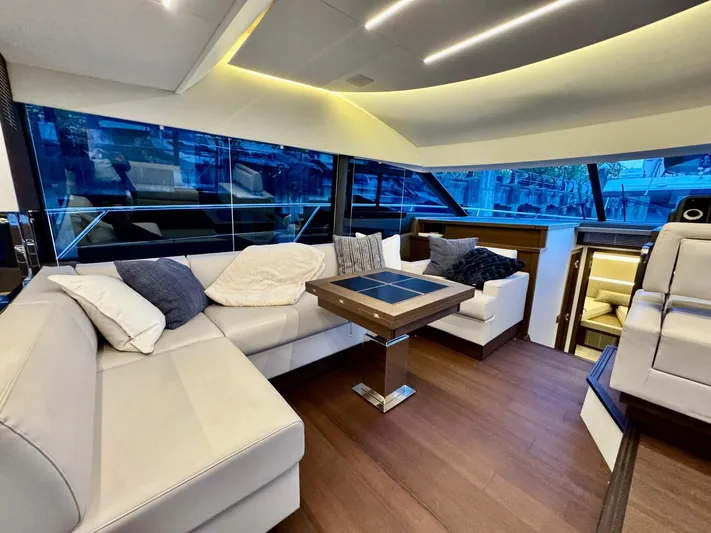 Seacresea Yacht Photos Pics Luxurious interior of a 2019 Prestige 520 yacht with modern seating and elegant lighting.