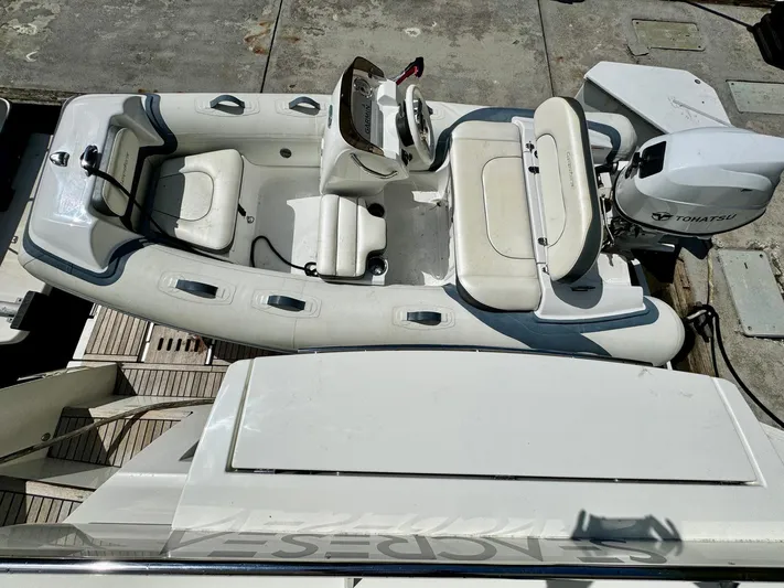 Seacresea Yacht Photos Pics Inflatable boat with Yamaha engine on dock, viewed from above.