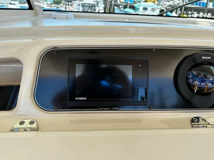 Katy Lady Yacht Photos Pics Dashboard of 2017 Grady-White Canyon 376 boat with Yamaha display and Ritchie compass.