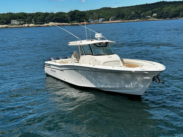 Katy Lady Yacht Photos Pics 2017 Grady-White Canyon 376 boat on water, scenic background.