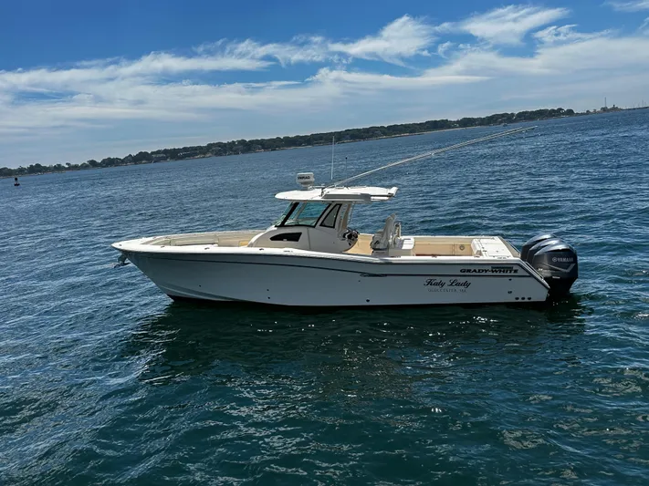 Katy Lady Yacht Photos Pics 2017 Grady-White Canyon 376 boat on calm water under a clear sky.