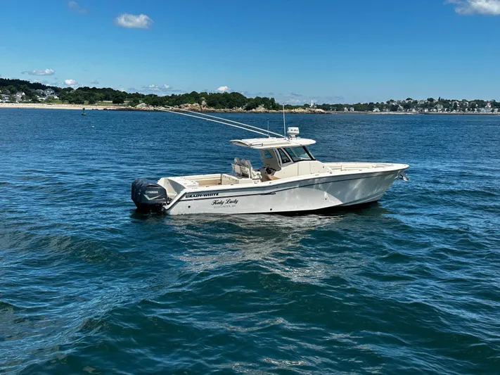 Katy Lady Yacht Photos Pics 2017 Grady-White Canyon 376 boat on calm blue water, scenic coastal background.